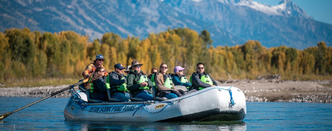 group of guests and guide floating on the snake river outside of jackson